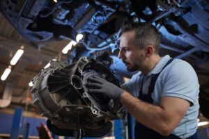 auto-mechanic-fixing-car-on-lift.jpg