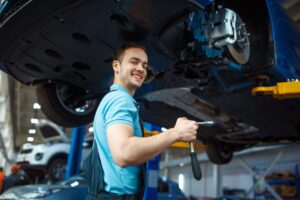 repairman-repairing-vehicle-on-lift-car-service.jpg