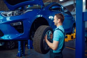 worker-removes-wheel-from-vehicle-car-service.jpg